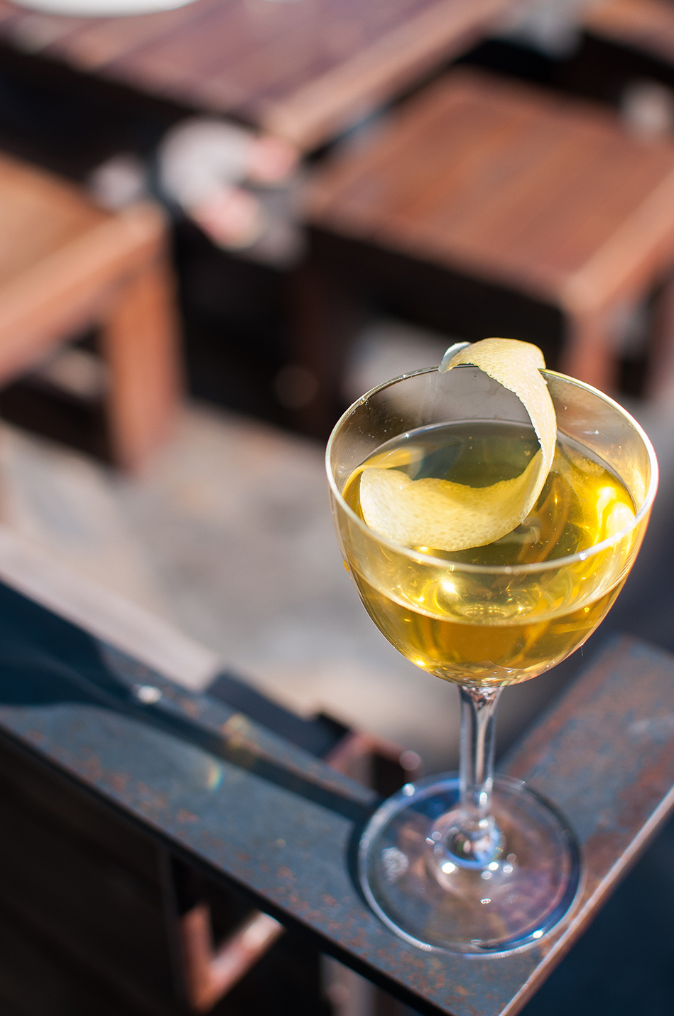 Cocktail drink with lemon zest at Barcelona Wine Bar